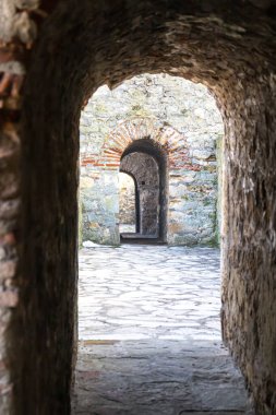 Medieval doorway and passes on the old stone wall. Old fortress tunnel from 15th century. The Smederevo Fortress, a medieval fortified city in Smederevo, Serbia clipart