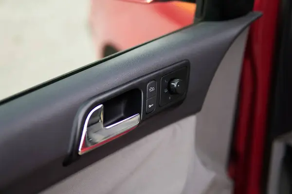 Passenger car door handle from the inside with lock buttons