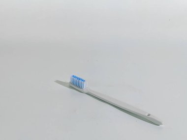 Close-up of a new toothbrush isolated on a white background. Copy space
