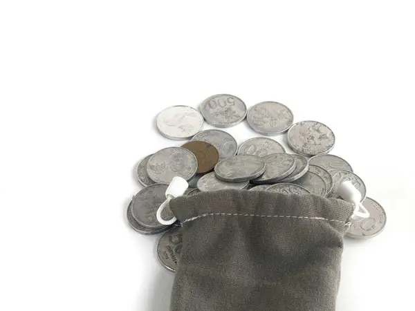 stock image 500 rupiah coins. Rupiah coins. taken out of a small bag. Stack of Indonesian Rupiah silver coins.