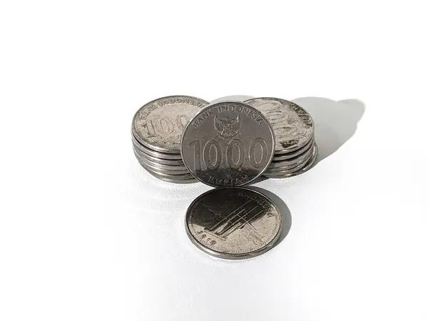 stock image 1000 rupiah coins. Rupiah coins. Stack of Indonesian Rupiah silver coins.