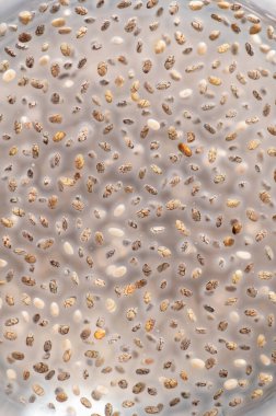 Water with chia seeds, macro, texture, background, vertical format