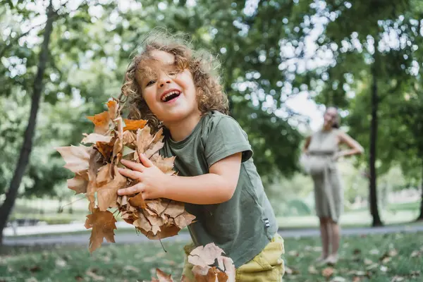 Portrait Happy Boy Playing Grass Dry Leaves Park Sunny Day — Stock Photo, Image