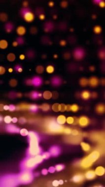 Siyah Arkaplan Üzerine Pembe ve Sarı Parlayan Parçacıkların Dikey Videosu