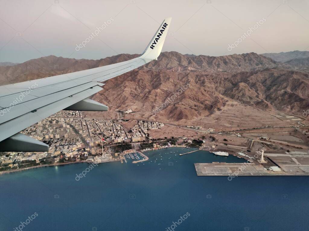 Aqaba, Jordan January 5, 2023 Panoramic glimpse of the Jordanian coastline from the window of