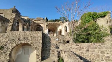 Ischia, Campania, Italy  May 12, 2022: Overview from the ruins of the 14th century Cathedral of the Assunta to the Aragonese Castle