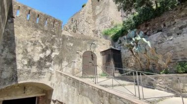 Ischia, Campania, Italy  May 12, 2022: Overview of the Aragonese Castle from the entrance ramp