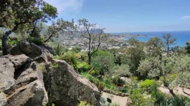 Forio, Campania, Italy  May 14, 2022: Panorama of the bay of Forio from the Giardini La Mortella, the botanical garden created starting in 1956 by Susana Walton