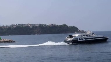 Procida, Campania, Italy  September 30, 2021: Snav hydrofoil leaving the port of Marina Grande