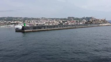 Pozzuoli, Campania, Italy  October 2, 2021: Overview of the village from the ferry entering the port