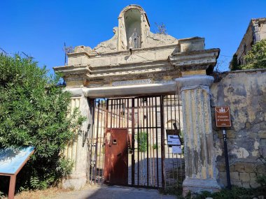 Procida, Campania, Italy  October 1, 2021: The sixteenth-century Palazzo d'Avalos, transformed into a Penal Institute in the nineteenth century, which dominates the medieval village of Terra Murata clipart