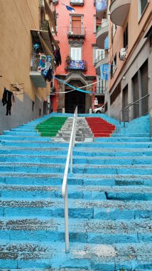 Naples, Campania, Italy - April 24, 2023: Glimpse of the alleys of the historic center festively decorated waiting for the conquest of the 3rd championship of the Napoli football team clipart