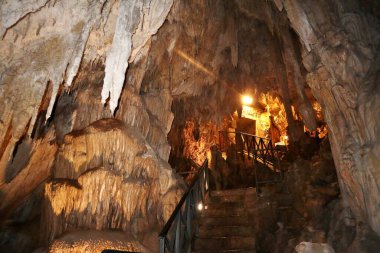 Maratea, Basilicata, Italy - September 22, 2023: Small cave under the Strada Statale 18 in the Grotte area rich in stalactites, stalagmites and limestone formations that look like a nativity scene clipart