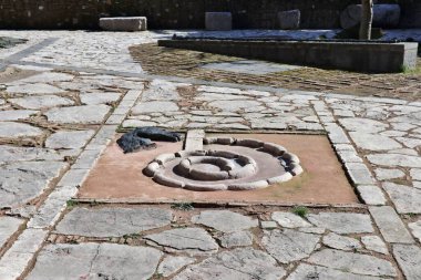 Benevento, Campania, Italy  15 February 2024: Hortus Conclusus, the garden of the thirteenth-century Convent of San Domenico, now a university building, which has hosted works by the artist Mimmo Paladino since 1992. clipart