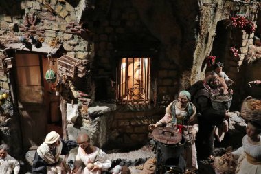 Naples, Campania, Italy  28 March 2024: The Fabulous Nativity Scene in the sacristy of the Basilica of Santa Maria della Sanit created by the La Scarabattola nativity scene art workshop of the Scuotto brothers clipart