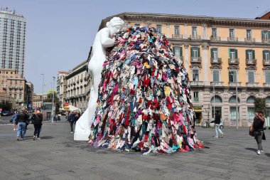 Naples, Campania, Italy  30 March 2024: The new Venus of Rags by Michelangelo Pistoletto, rebuilt after the vandalism fire of 12 July 2023, relocated to Piazza Municipio on 6 March 2024 clipart