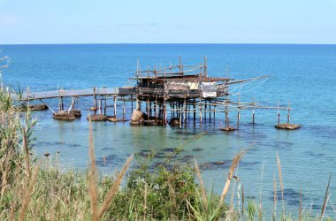 Vasto, Abruzzo, Italy - May 29, 2024: Stretch of the Costa dei Trabocchi between Lungomare Cordella and Trabocco Cungarelle facing the Submerged Archaeological Park of the Roman port of Histonium clipart
