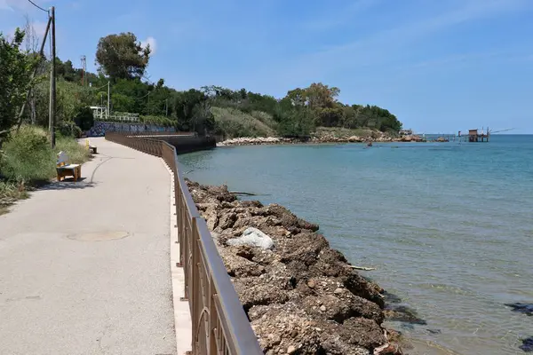 stock image Vasto, Abruzzo, Italy - May 29, 2024: Stretch of the Costa dei Trabocchi between Lungomare Cordella and Trabocco Cungarelle facing the Submerged Archaeological Park of the Roman port of Histonium