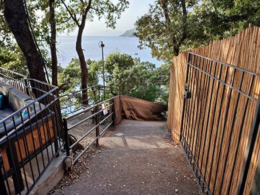 Maratea, Basilicata, Italy - September 22, 2023: Path that descends towards the Black Beach at Cala Jannita in Grotte Localit clipart