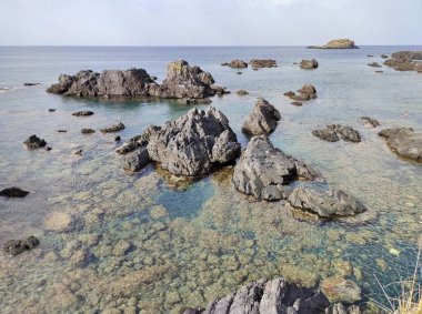 Maratea, Basilicata, İtalya - 21 Eylül 2023: Punta della Matrella 'daki İllicini Köyü' ne bakan Cliff