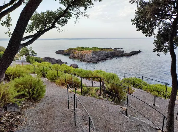 stock image Maratea, Basilicata, Italy - September 22, 2023: Cliff at Punta della Matrella from Le Terrazze Solarium at dawn