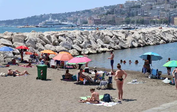 stock image Naples, Campania, Italy  August 6, 2024: Free beach of Lido Mappatella of Rotonda Diaz on Lungomare Caracciolo