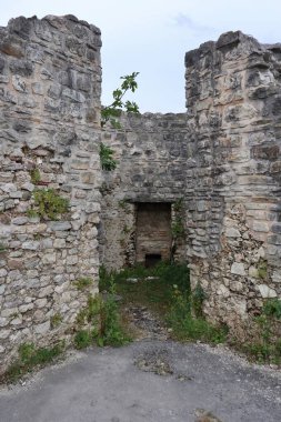 Laviano, Campania, Italy  June 24, 2023: Norman Castle dating back to the 10th century that dominates the village from the top of the Rupe dellOlivella clipart