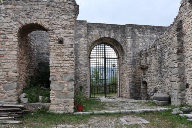 Laviano, Campania, Italy  June 24, 2023: Norman Castle dating back to the 10th century that dominates the village from the top of the Rupe dellOlivella clipart