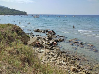 Agropoli, Salerno, Campania, Italy  August 31, 2024: Tourists on the beach of Trentova Bay clipart