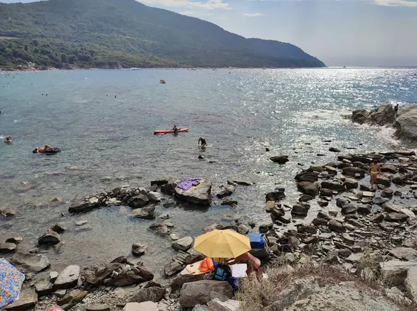 stock image Agropoli, Salerno, Campania, Italy  August 31, 2024: Tourists on the beach of Trentova Bay