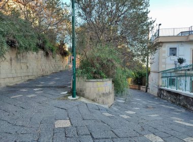 Naples, Campania, Italy  November 23, 2024: Access road to Cala San Basilio and the Marine Protected Area of the Gaiola Underwater Park from Via Tito Lucrezio Caro to Posillipo clipart