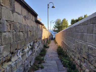 Naples, Campania, Italy  November 23, 2024: Access road to Cala San Basilio and the Marine Protected Area of the Gaiola Underwater Park from Via Tito Lucrezio Caro to Posillipo clipart