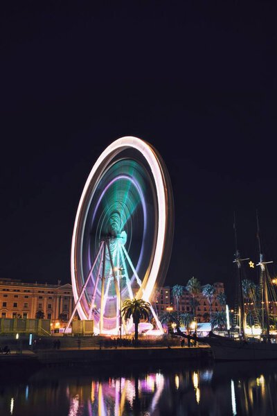 Ferris wheel in motion in the port of Barcelona, Spain, on December 22, 2023