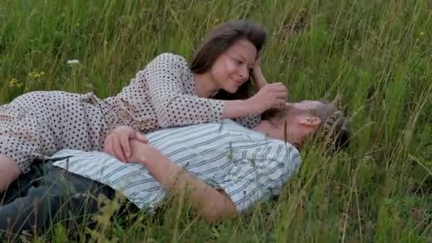 Young Couple Relaxing Lying Ground Outdoors Woman Smiling Stroking Her — Stock video