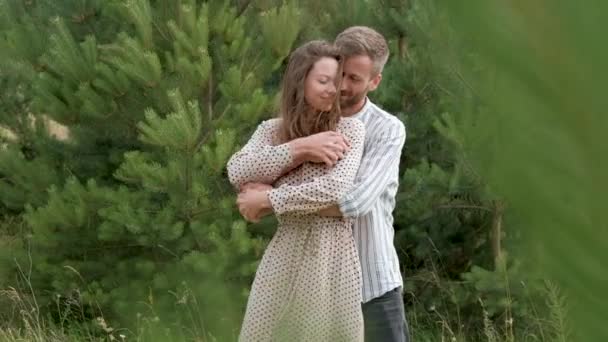 Happy Young Couple Love Man Woman Hugging Outdoors Fir Trees — Stock video