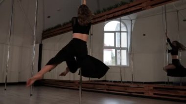 Pole Dancer Does Acrobatic Elements, Athletic Young Woman Performs Tricks on Pylon, Sport and Healthy Lifestyle