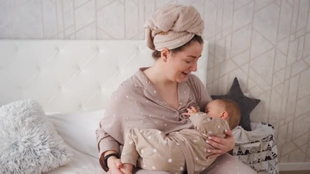 Happy Young Mother Breastfeeding Stroking Baby Child Bedroom Home — Vídeos de Stock