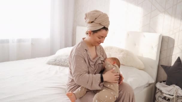 Happy Young Mother Breastfeeding Stroking Her Baby Child Bedroom Home — Stock Video