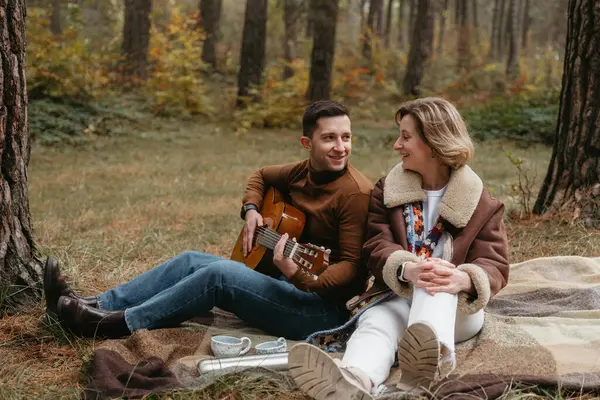 Cheerful Man Playing Guitar Happy Woman While Sitting Blanket Autumn Royalty Free Stock Photos