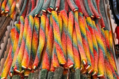 Colorful candy stall in the market. Licorice. clipart