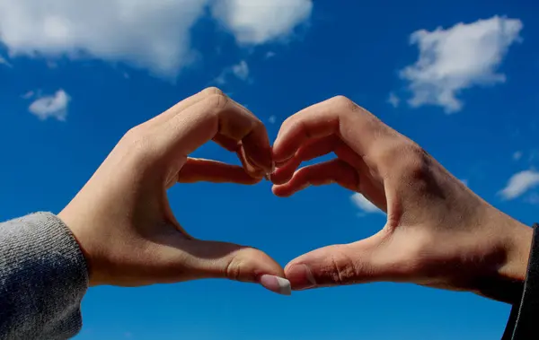 Two Hands Shape Heart Blue Sky Background Stock Image