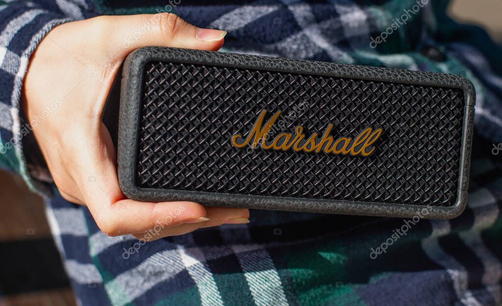 Portable Marshall Bluetooth Speaker in Hand Outdoors
