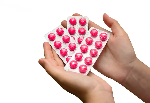 Kişi Elleri Üç Pembe Hap Paketi Tutuyor