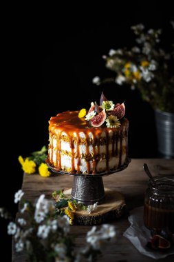 cake with flowers on a wooden table