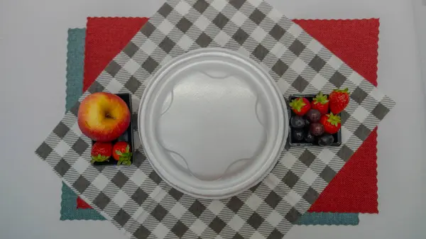 typical Brazilian food sealed in a Styrofoam container for home delivery with fruits
