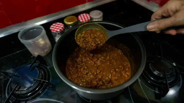 stock image shredded beef in tomato sauce traditional Brazilian snack