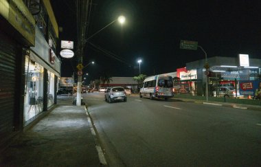 Suzano, Sao Paulo - Brazil - June 23, 2024: One of the busiest points in the city of Suzano, where there is a huge supermarket and a large shopping center clipart