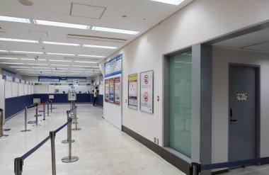 Kansai International Airport, Japan- 19 Jul 2024: Airport train customer service centre for enquiry and purchasing tickers with counters clipart