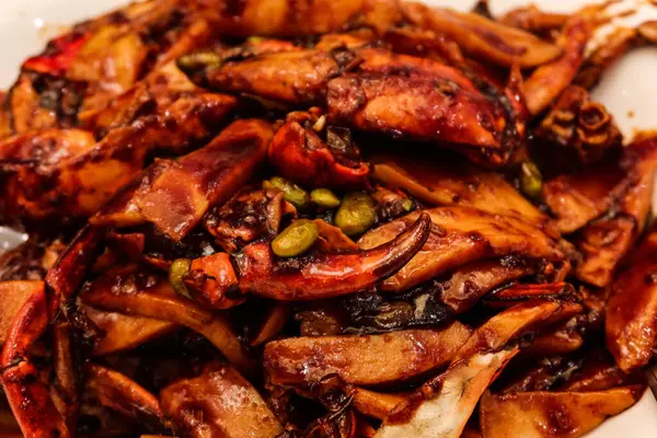 stock image close up of Chinese Shanghai style soy sauce stir fried crab and rice pudding on a white plate