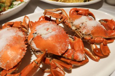 close up of Chinese cooking style Salt-Crusted Baked Virgin Crabs baked in salt clipart